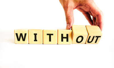 Without or with symbol. Concept words Without and With on wooden cubes. Beautiful white table white background. Businessman hand. Business without or with concept. Copy space.