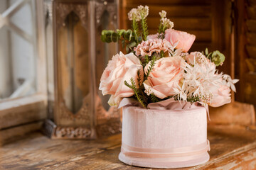 flower composition on the window with a decorative candlestick