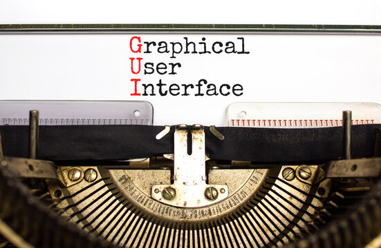 GUI graphical user interface symbol. Concept words GUI graphical user interface typed on old retro typewriter. White background. Business and GUI graphical user interface concept. Copy space.