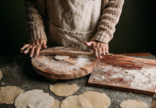 Mom making tortillas with her daughter 