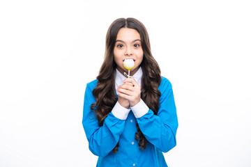 Teenager girl eating sugar lollypop. Candy and sweets for kids. Child eat lollipop popsicle over white isolated background. Yummy caramel, candy shop.