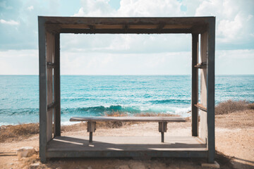 Romantic bench near the Ocean, sea with cliffs, waves in sea, coast line, summer time