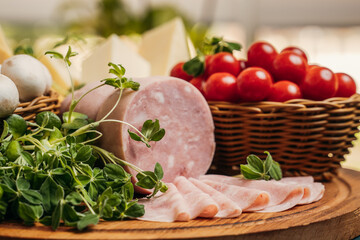 products for cooking pizza: cherry tomatoes, mushrooms, cheese, ham and greens