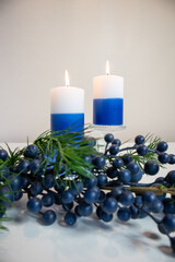 candles and decorations, blues and whites, holiday feeling.
