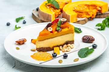 Cheesecake dessert with nuts on a light background. top view
