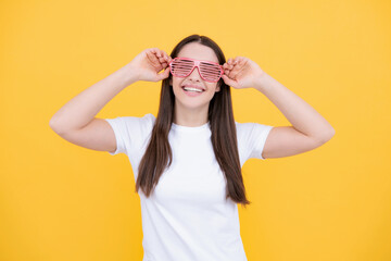 Portrait of beautiful party woman in funny carnival glasses. Excited girl.