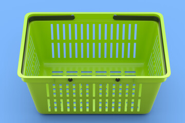 Plastic basket from supermarket for online shopping on blue background.