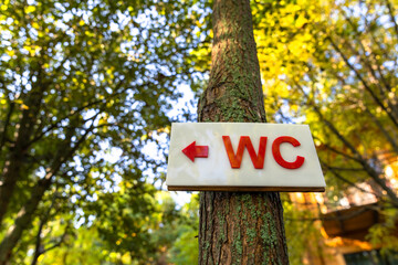 WC sign on wood