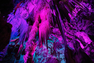 Saint Michael's Cave with colorful lights. Natural Rock Formation. Gibraltar, UK.