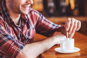 Handsome young man at cafe