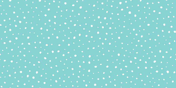 Hand drawn falling snow seamless pattern, uneven round fading chaotic dots, spots, flakes. Sketched white snowflakes on sky blue repeating snowfall background. 