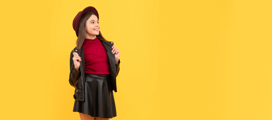 happy teen girl in hat and leather clothes, trend. Child face, horizontal poster, teenager girl isolated portrait, banner with copy space.