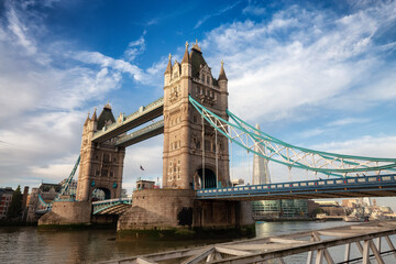 Historic Bridge over River Thames and Cityscape Skyline during dramatic sunrise. Tower Bridge in...
