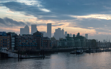 Naklejka premium View of River Thames and City Skyline during dramatic sunrise. City of London, United Kingdom. Travel Destination