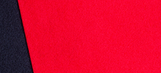 Red and black color felt textile fabric texture background. Top view