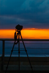 Beautiful alpine sunset with a tripod and DSLR silhouette at the famous Saentis summit, Schwaegalp, Appenzell, Alpstein, Switzerland