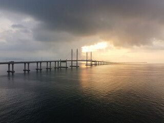 Fototapeta na wymiar Sunrise hour over morning low cloud at Penang Second Bridge