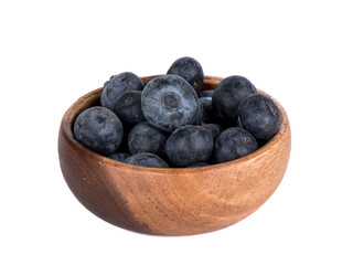 Fototapeta na wymiar Wooden bowl full of ripe blueberries isolated on white background.