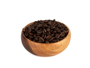 Freshly roasted coffee beans in a wooden bowl over white background.