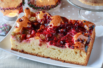 A cake with red summer fruits.