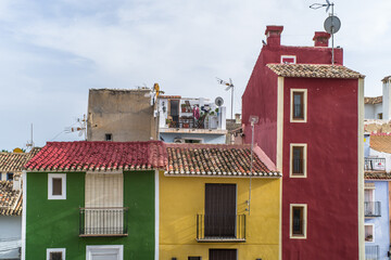 old colorful buildings in the historic center of Villajoyosa. Narrow streets and colorful tenement houses