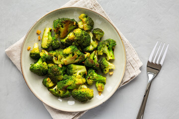 Homemade Pan-Fried Broccoli on a Plate, top view. Flat lay, overhead, from above.