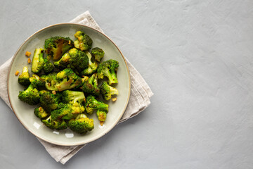Homemade Pan-Fried Broccoli on a Plate, top view. Flat lay, overhead, from above. Copy space.