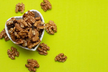 bowl full of almonds on a colored background