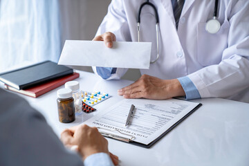 doctor or pharmacist writes a diagnosis and gives a prescription to a male patient. as a guideline for continued treatment find a good solution for the patient