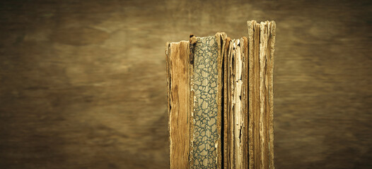 Old books on a blurry background.Restoration of books.Battered, violent encyclopedia covers.An old...