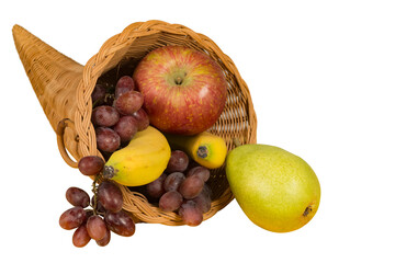 Isolated cornucopia filled with overflowing fruit
