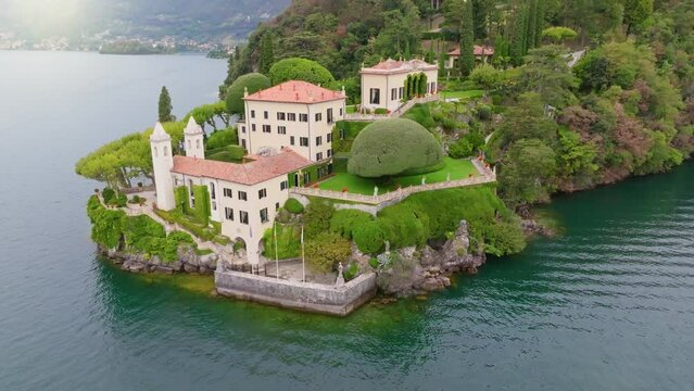 Flying around of Villa del Balbianello, Lake Como, Italy. Beautiful garden and villa on the shores. Tremezzina, Como Lake, Lombardy, Italy