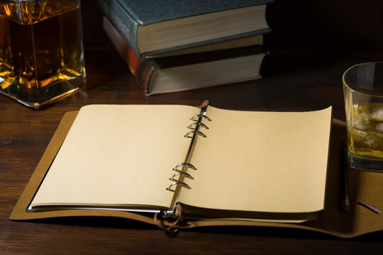 Ready to write, a glass of whiskey and some books