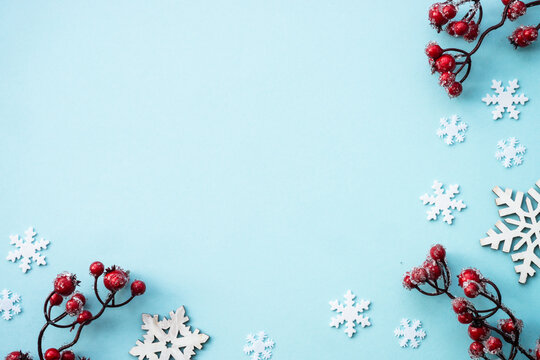 Christmas composition with holiday decorations on blue.
