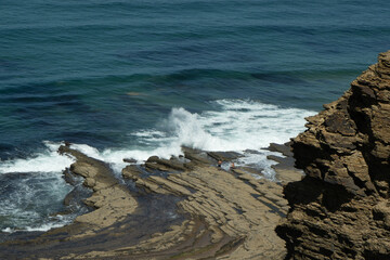 waves breaking on the rocks