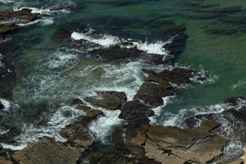 waves breaking on the rocks