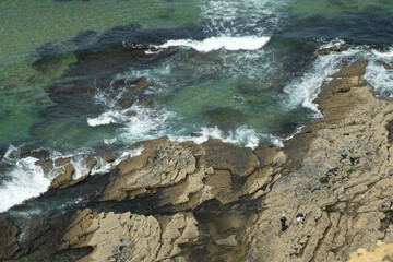 waves breaking on the rocks
