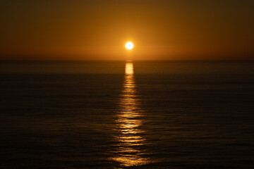Sun and sea sunset with reflection