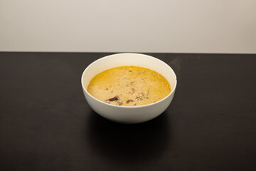 Cheese Burger Soup with ground beef cheese and a white bowl