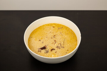 Cheese Burger Soup with ground beef cheese and a white bowl