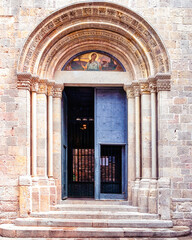 Fototapeta na wymiar Medieval door in the Barcelona cathedral located in the Gothic district in Barcelona, Spain