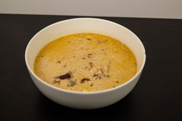 Cheese Burger Soup with ground beef cheese and a white bowl