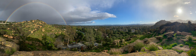 Fototapeta na wymiar Panorama of Chatsworth and San Fernando Valley with Rainbow