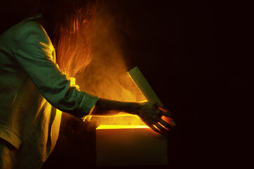 hands open a mysterious box