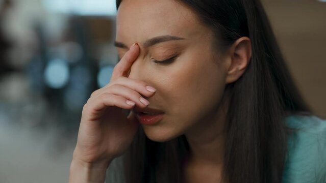 Stressed woman crying workroom alone. Frustrated office manager thinking problem