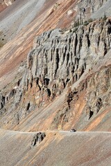 A jeep dwarfed by nature on the dangerous Ophir Pass road © Moxin