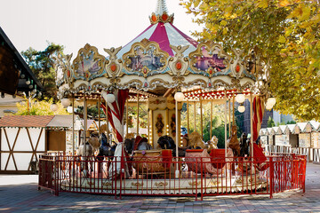 Colorful Carousel Attraction Ride With Wooden Horses.