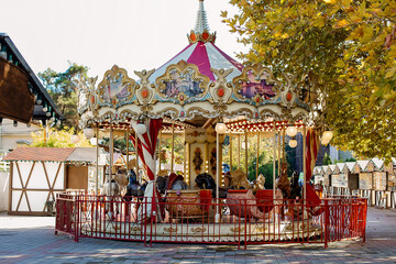 Colorful Carousel Attraction Ride With Wooden Horses.