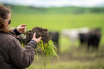 women in agriculture working on a ranch in America. Soil scientist feeling a soil sample. testing...