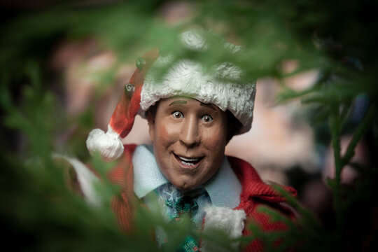 NEW YORK USA, OCT 26 2022: National Lampoons Christmas Vacations Clark Griswold looking in a tree for a squirrel - NECA action figure